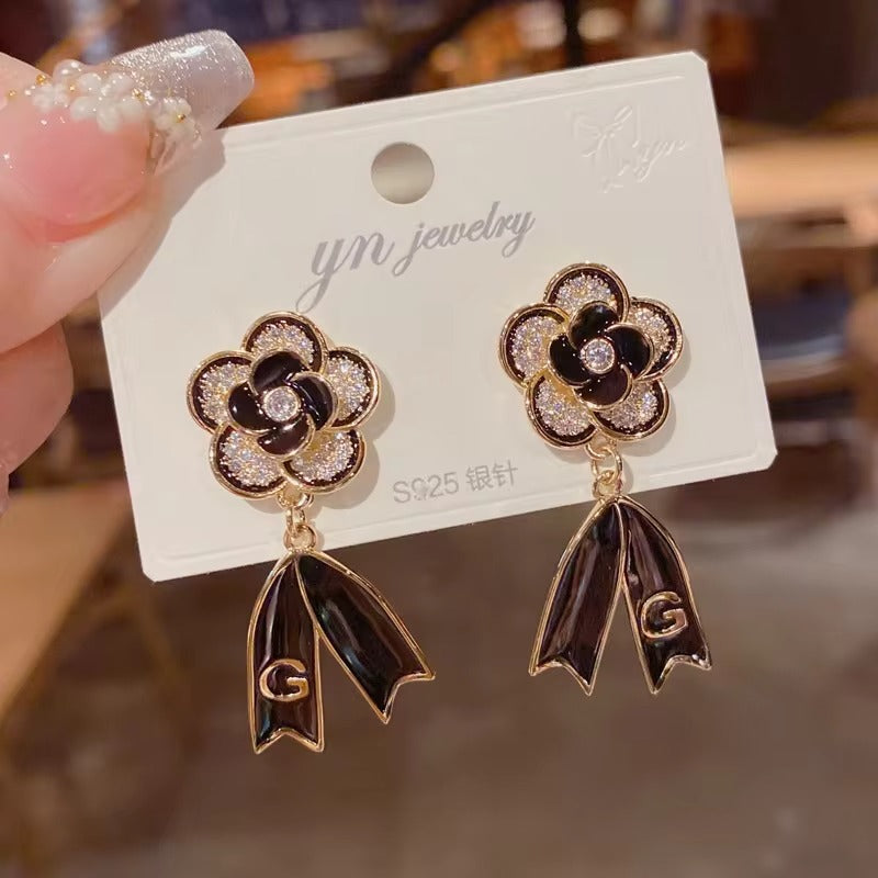 FS-ERS9NC - Black Camelia Bow Letter Earrings