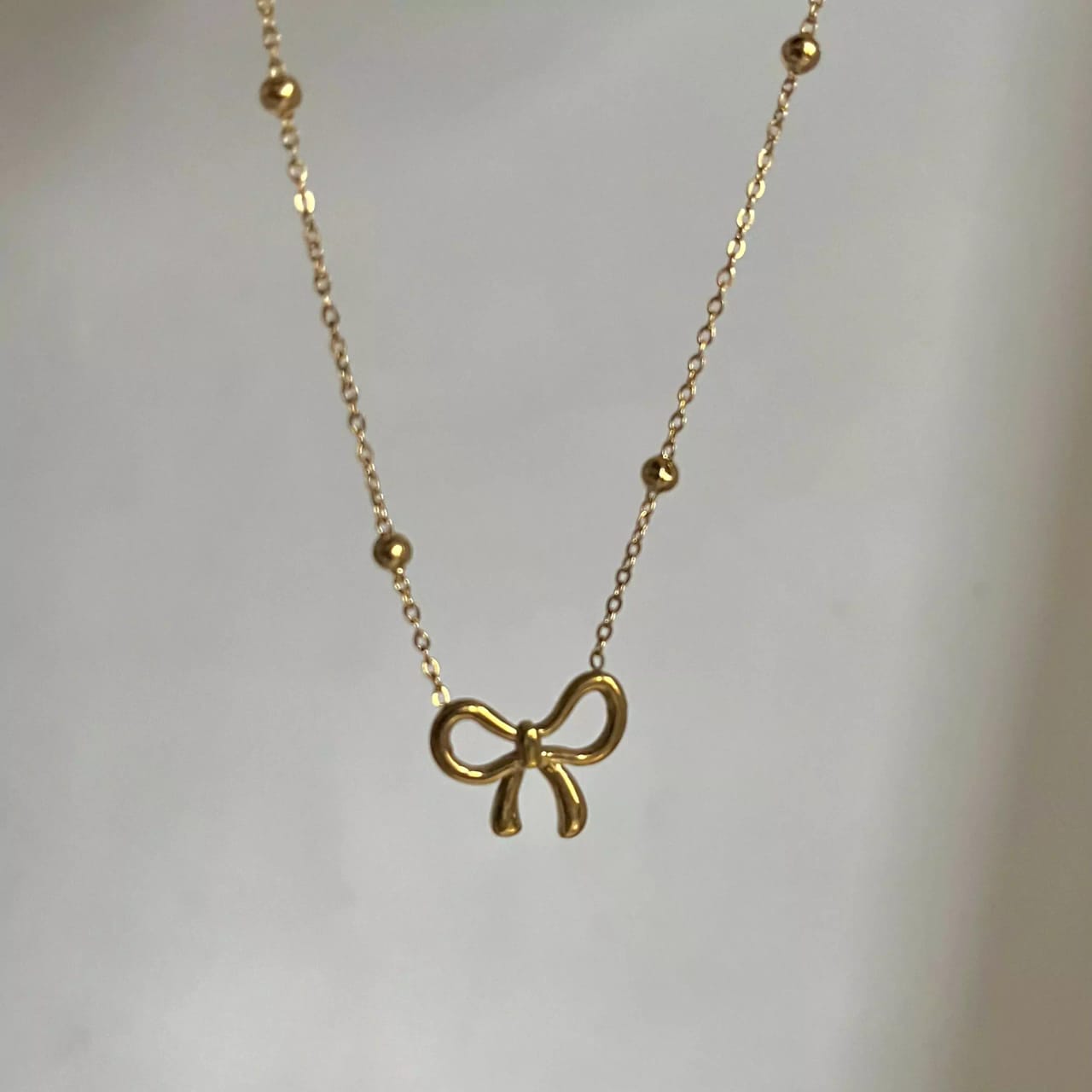 Model No. 358 Gold Plated Bow Shape Pendant Necklace